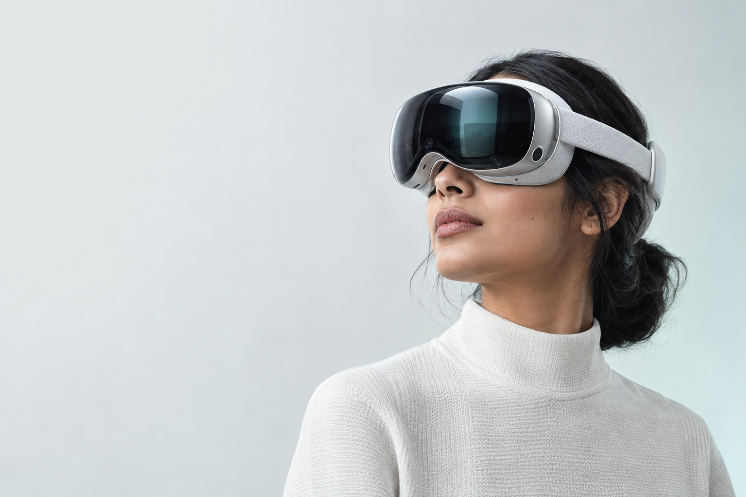 A woman exploring mixed reality through a silver and white headset